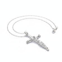 Silver crucifix necklace on a teal and gray background with 'DOOTEFFIL' branding.