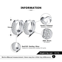 Silver huggie hoop earrings with pavé-set cubic zirconia stones, shown with dimension markings (10mm), close-up detail circles, and product information text on a white background. Brand logo 'Orsa Jewels' is visible in the top left.