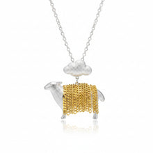 Sheep-shaped pendant with gold body and silver legs on a green background, brand 'GEEZENCA' visible.
