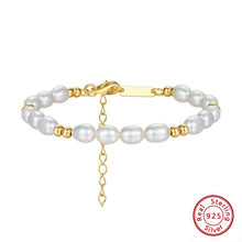 Pearl bracelet with gold accents and Orsa Jewels logo on a white background