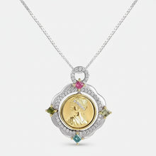 Gold pendant necklace with gemstones on a white background, featuring the brand 'Geezenca'.