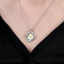 Necklace with a pendant worn by a person, brand 'GEEZENCIA' visible