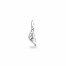 Silver wing-shaped earring worn on an ear with 'GEEZENCA' branding.