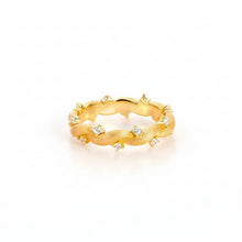 Gold ring with small diamonds on a white background, featuring the brand 'Geezenca'.