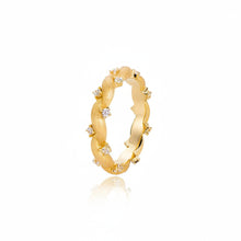 Gold ring with small diamonds on a white background