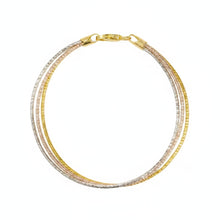 Gold and silver bracelet on a white background with 'Geezenca' branding.