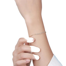 Silver bracelet on a wrist with a light blue background, featuring Orsa Jewels logo.